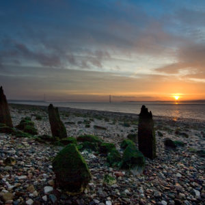 Photograph of the sunrise over the Humber Bridge from North Ferriby foreshore