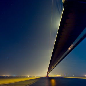 Night-time photograph of the Humber Bridge with constellations of stars clearly visible