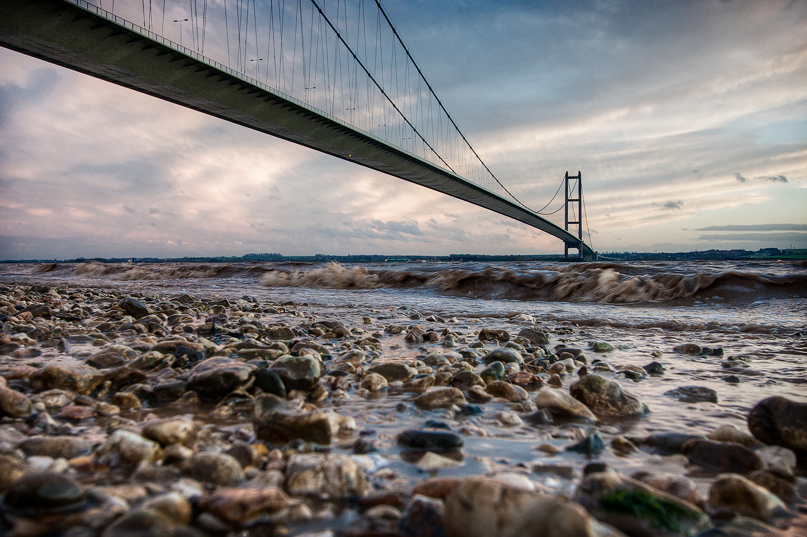 Low view point photo of the Humber Bridge at low tide